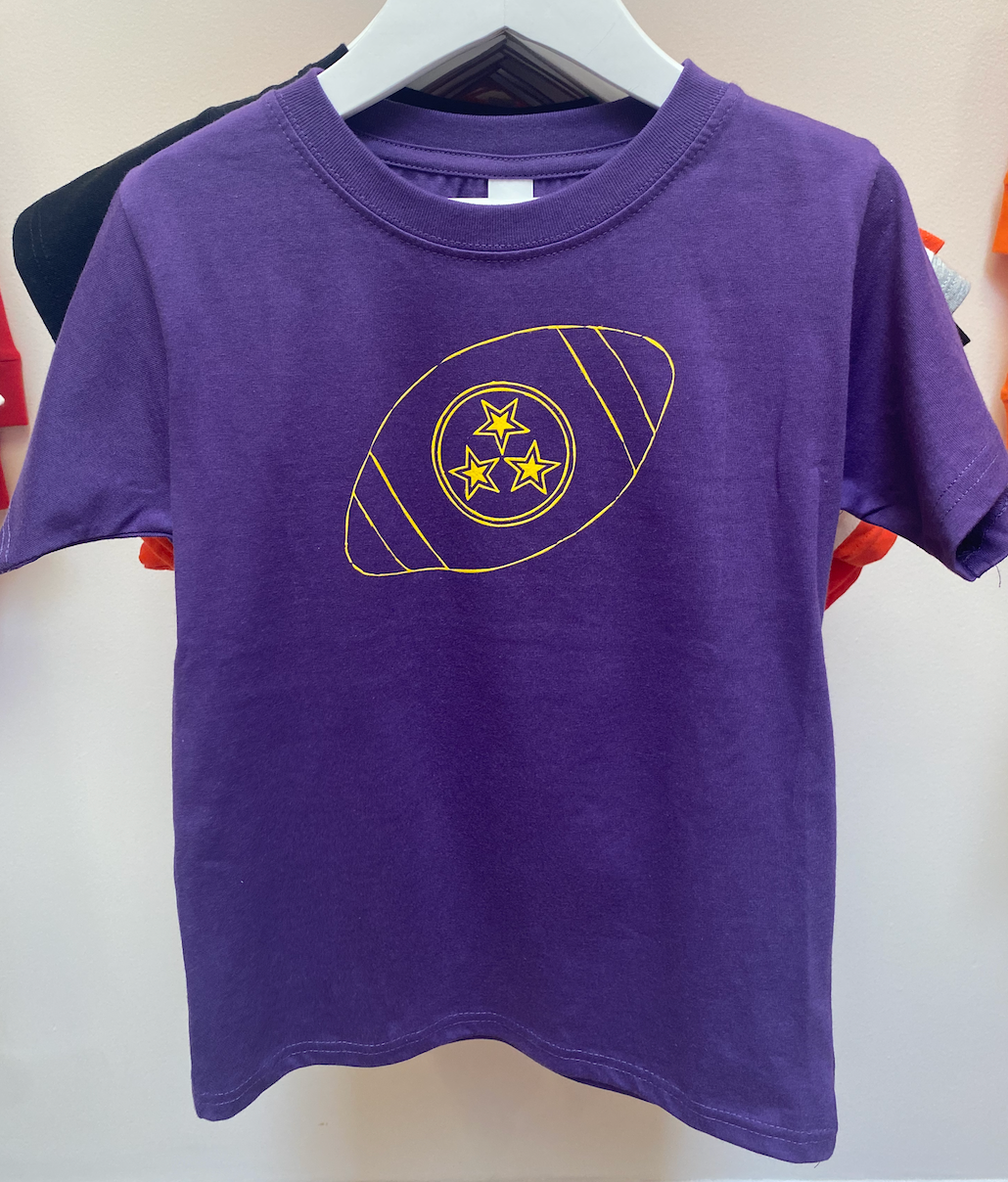 Football Stars on Purple Shirt with Yellow Print